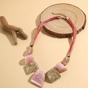 Elegant Pink and Gold Resin Necklace